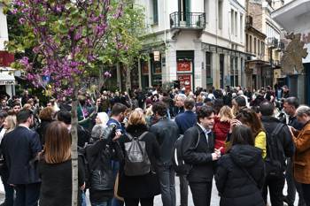 Crowds of people are gathered in the street